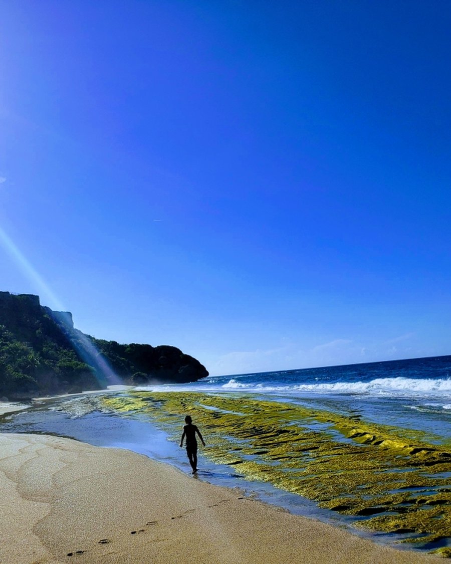 Walking the tide line at Borinquen, Puerto Rico